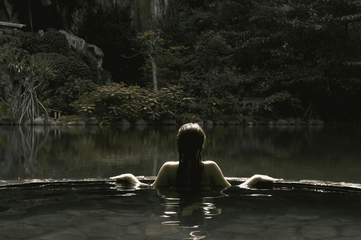 Guest embracing holistic healing on a peaceful luxury wellness retreat