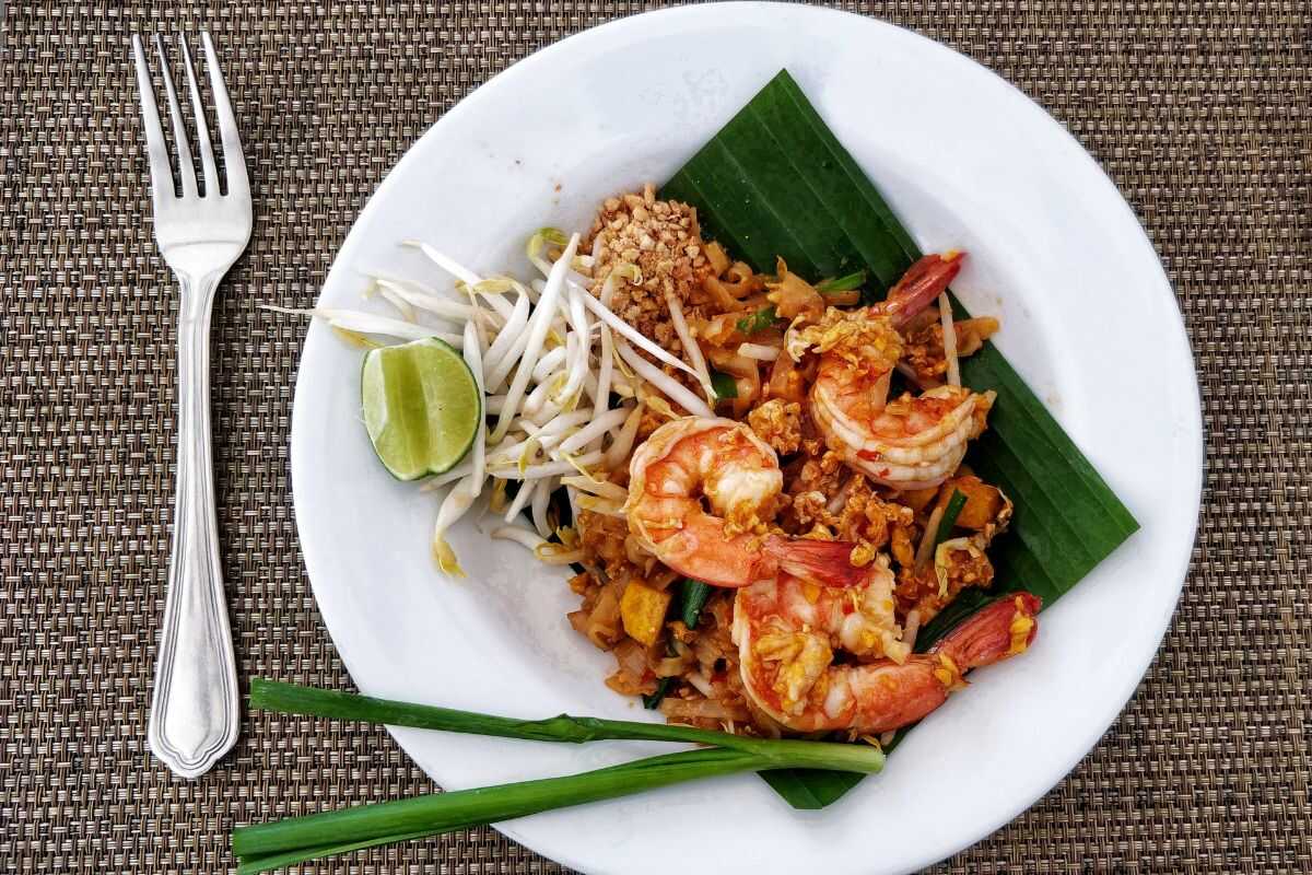 Authentic Pad Thai dish prepared by a student at a Thai cooking class in Bangkok.