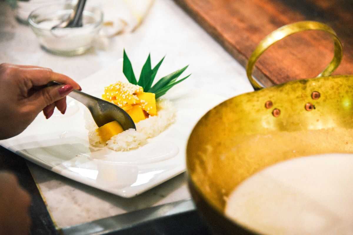 Traditional Thai dessert Mango Sticky Rice prepared during a cooking class