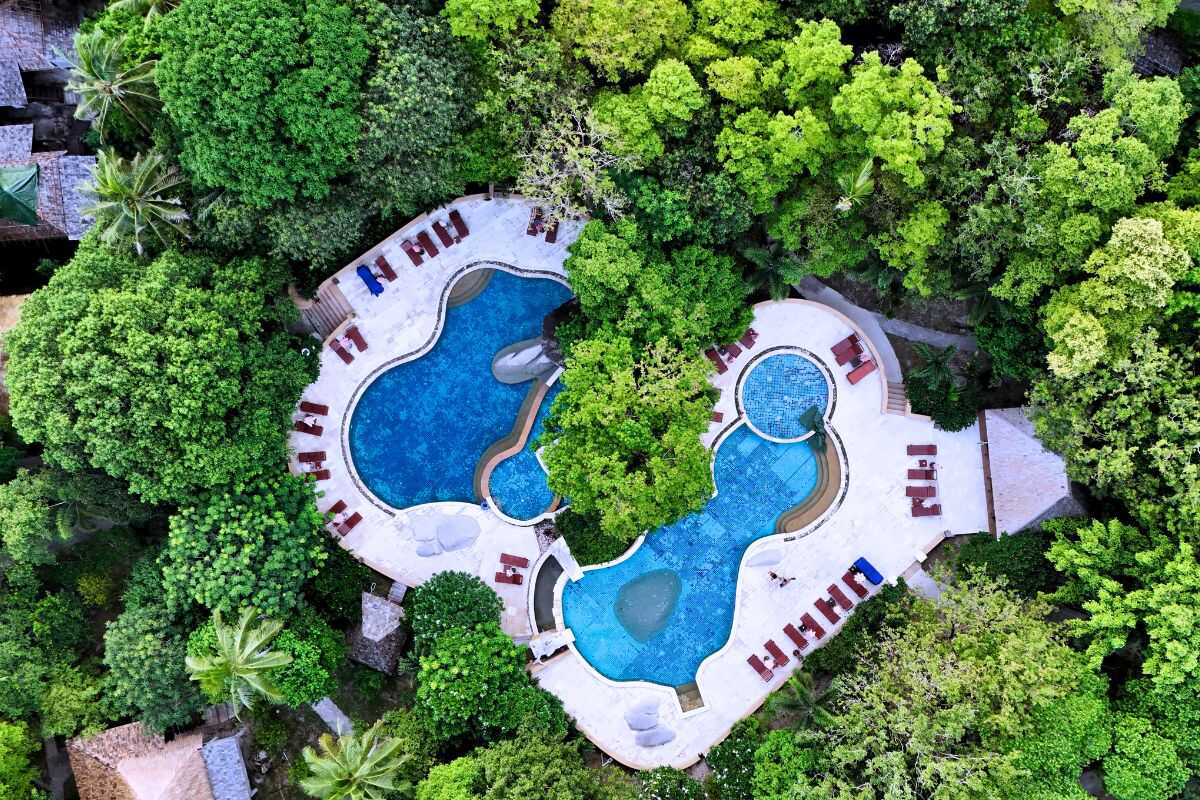 Sensi Paradise Beach Resort hillside bungalows overlooking Mae Haad Beach, Koh Tao