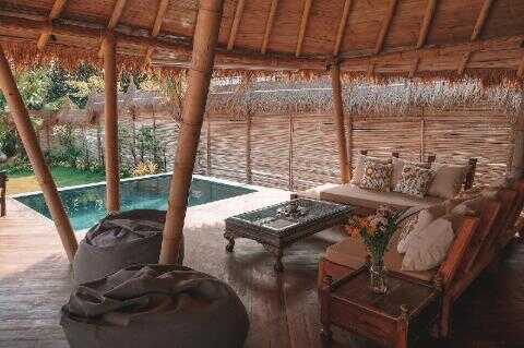 Aloe Ecological Boutique Villas interior Krabi Thailand – king bedroom with natural materials and sea-facing balcony