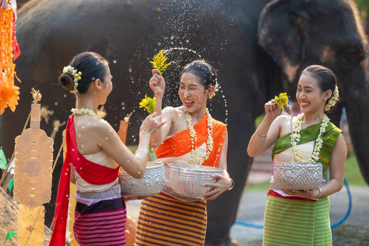 Traditional Songkran ceremony with water for spiritual cleansing in Thailand 2025